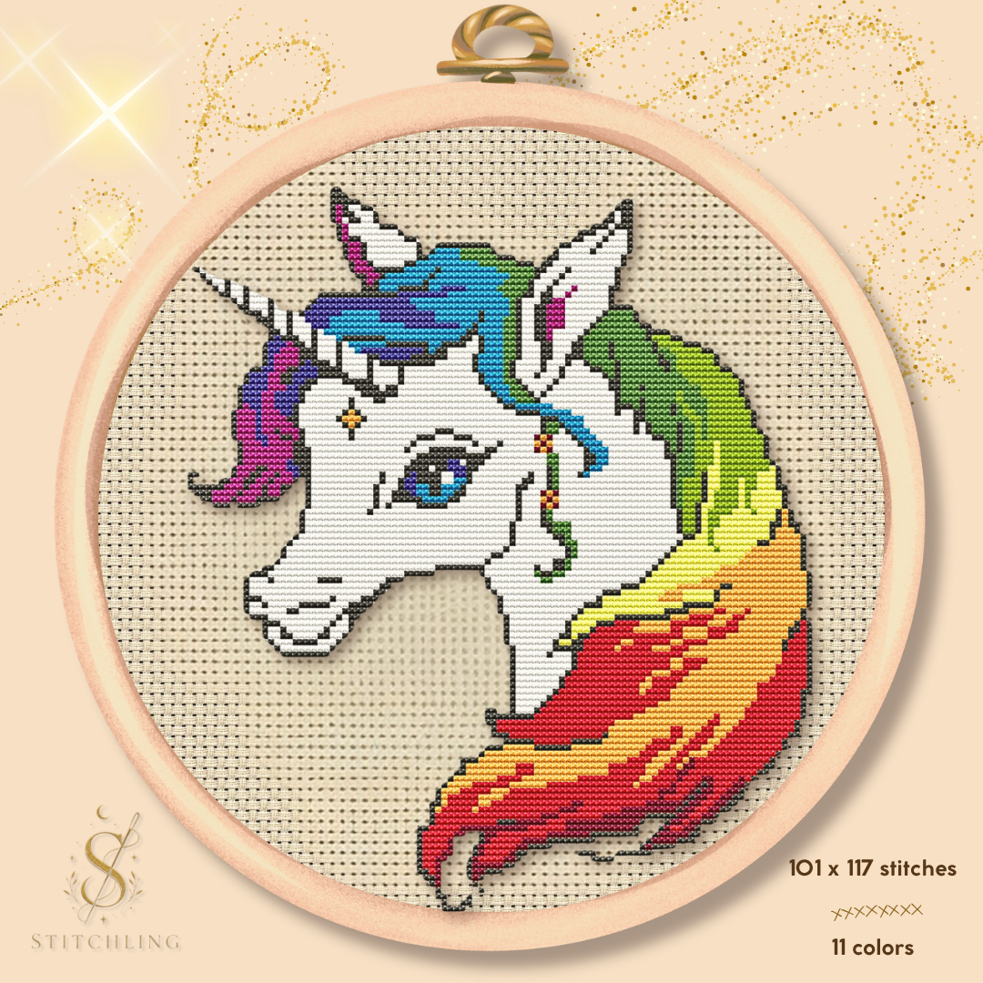 Rainbow Unicorn cross stitch pattern featuring a white unicorn with a colorful rainbow mane, whimsical fantasy embroidery design stitched in a wooden hoop, magical PDF pattern for unicorn lovers by Stitchling.