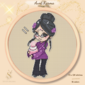 Preview of the Aunt Karma cross stitch pattern in an embroidery hoop, featuring a chibi witch with dark hair, glasses, a purple outfit, and a pink birthday cake on a warm beige fabric background.