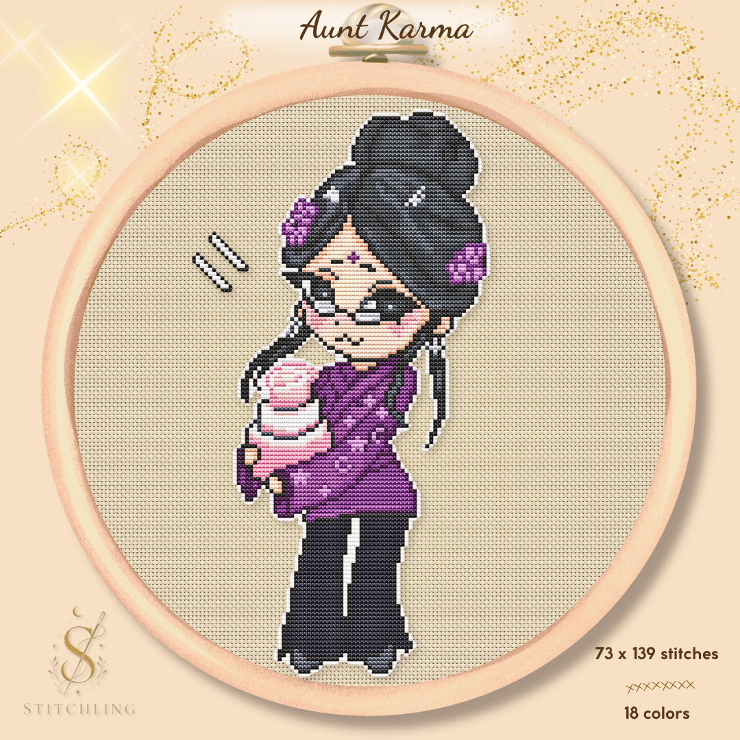 Preview of the Aunt Karma cross stitch pattern in an embroidery hoop, featuring a chibi witch with dark hair, glasses, a purple outfit, and a pink birthday cake on a warm beige fabric background.