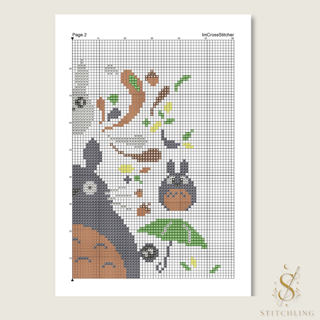 Sample color cross stitch chart with symbols on a numbered grid, showing forest creatures, green leaves, and a leafy umbrella.