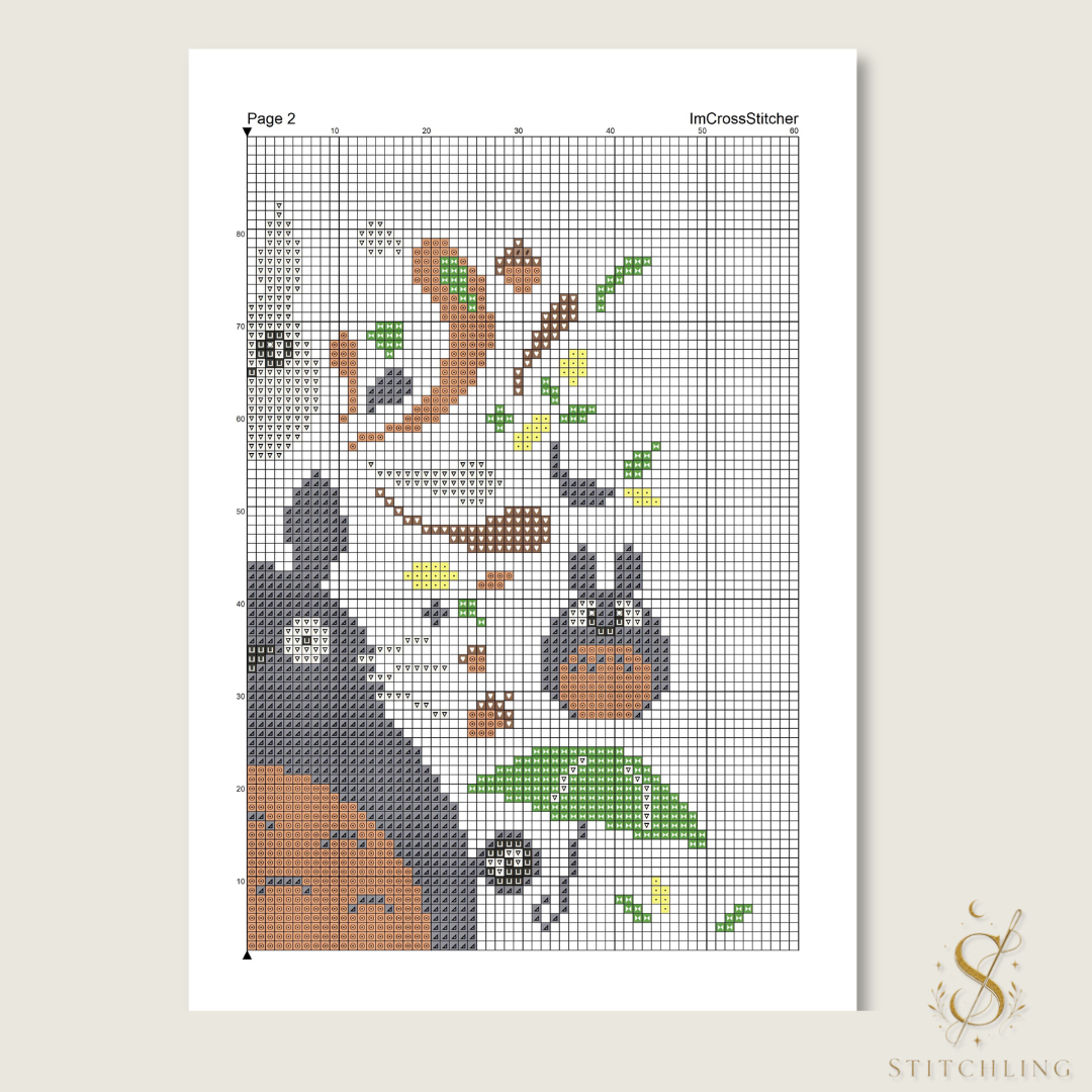 Sample color cross stitch chart with symbols on a numbered grid, showing forest creatures, green leaves, and a leafy umbrella.