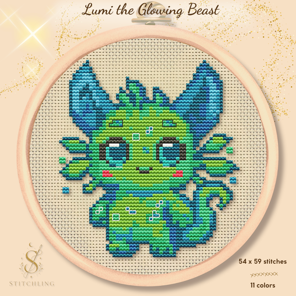 Lumi the Glowing Beast cross stitch pattern PDF featuring a cute fantasy creature with blue ears and green glowing details, modern counted cross stitch design for beginners and fantasy lovers